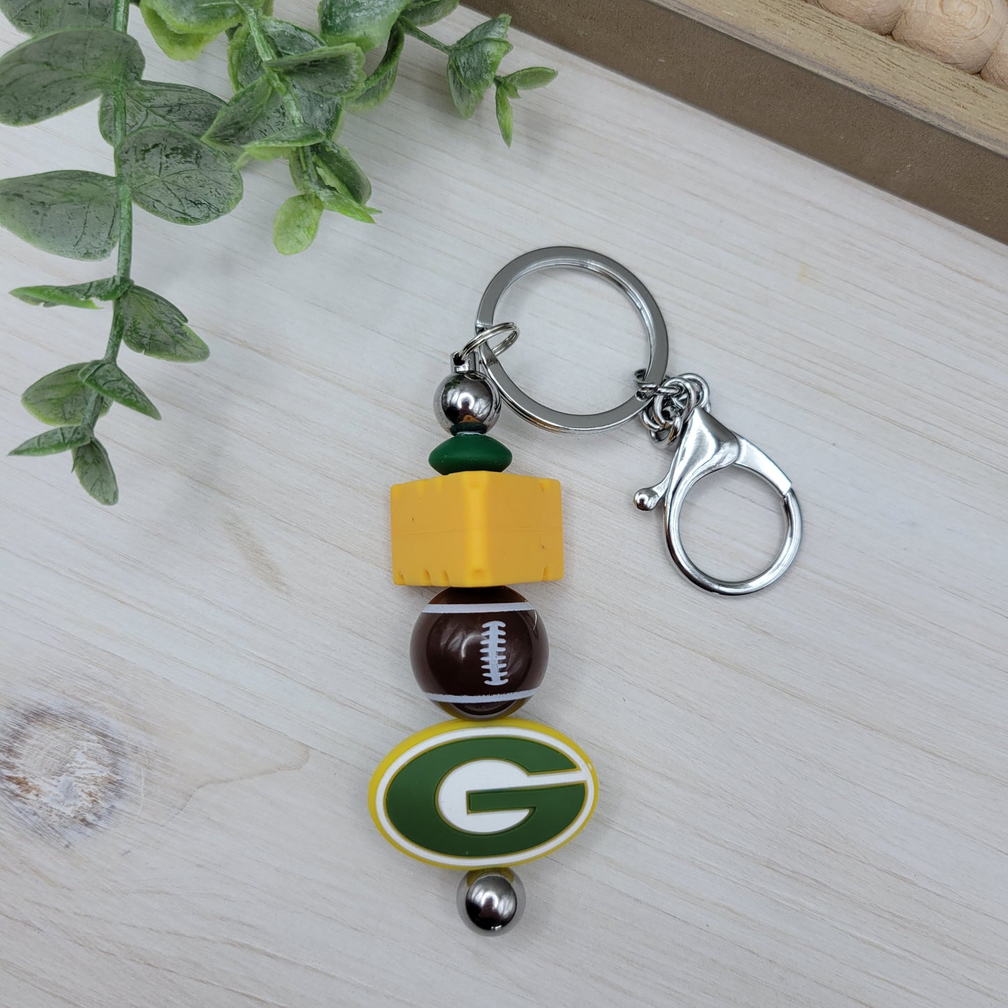 WI Football Barbell Keychain