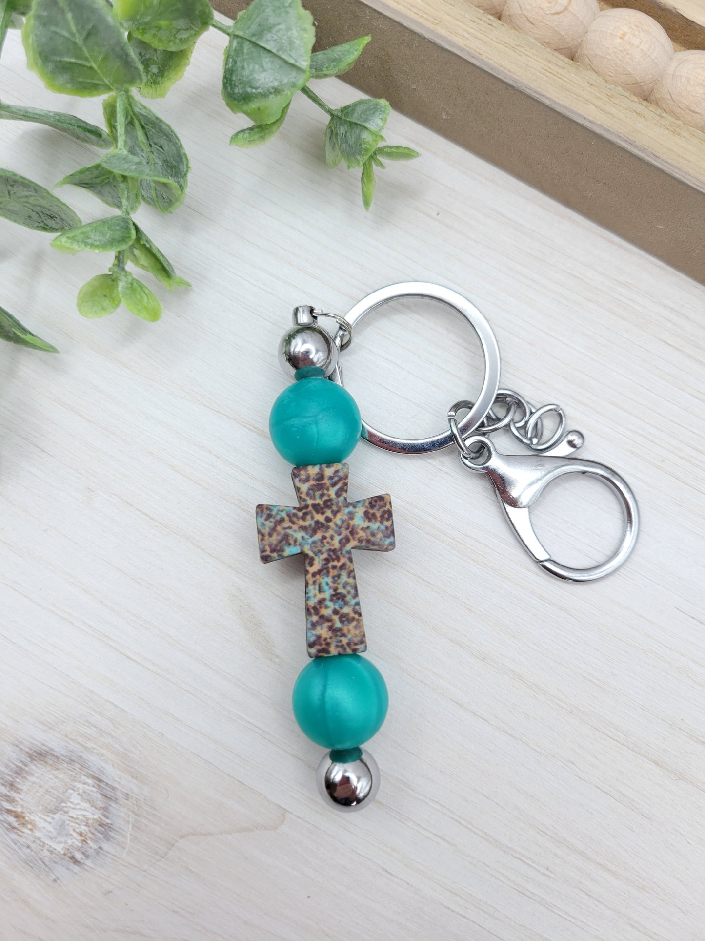 Teal Leopard Cross Barbell Keychain