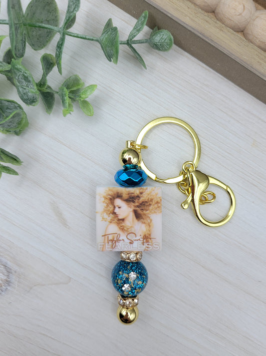 T.S. Teal & Gold Barbell Keychain