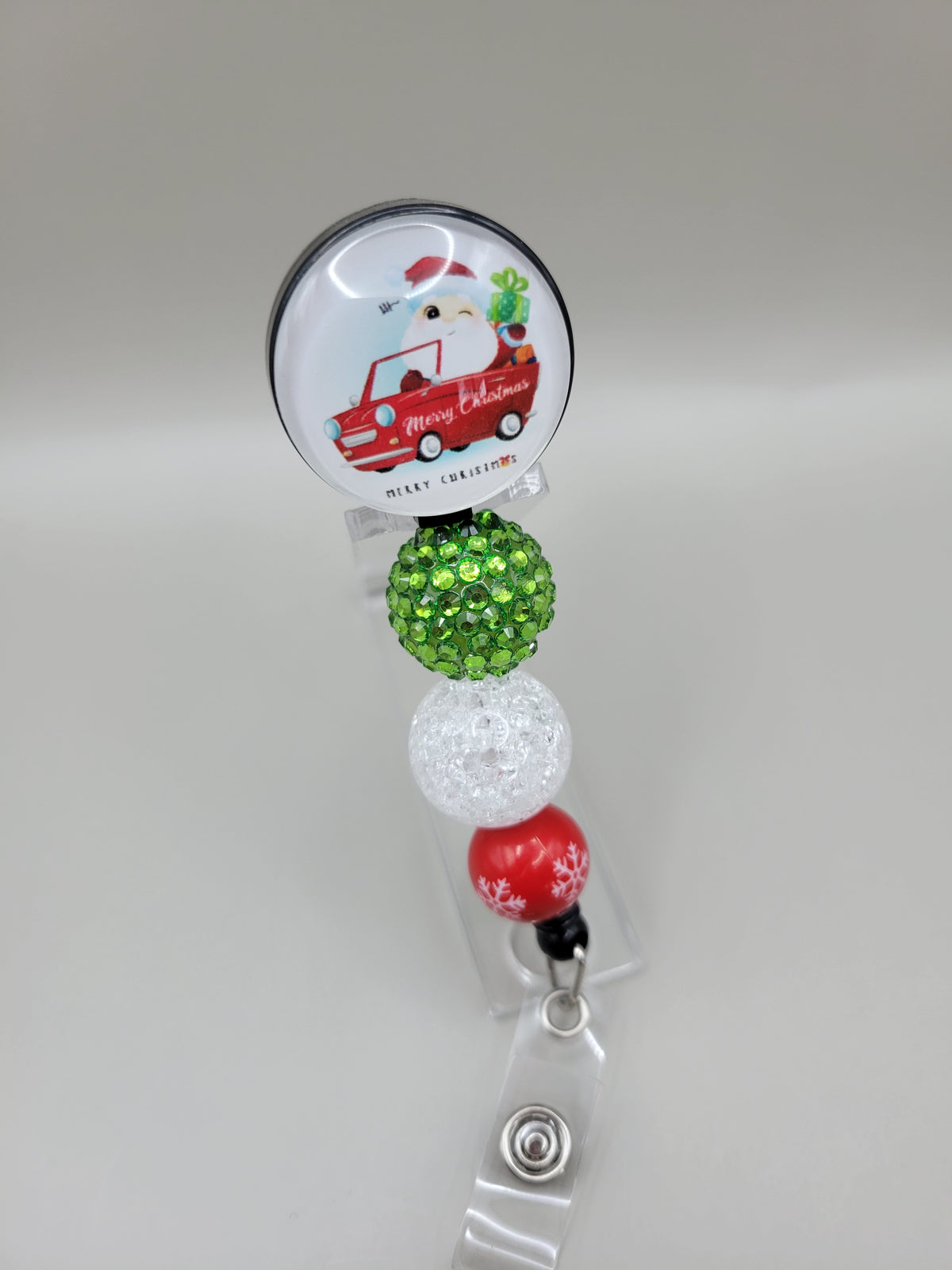 Santa in Car Badge Reel