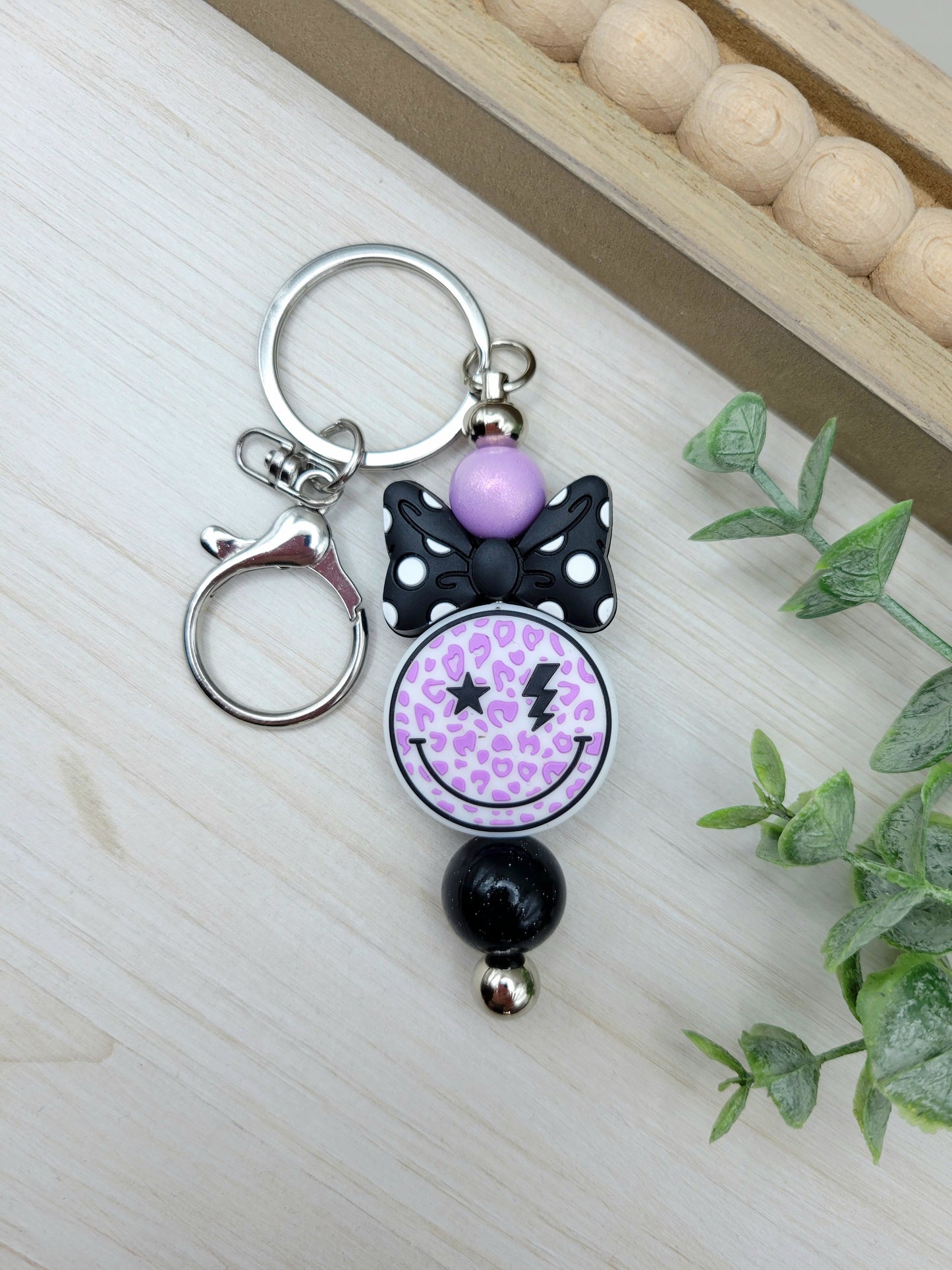 Purple Smiley with Bow Barbell Keychain