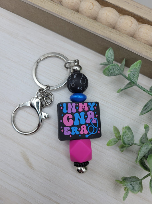 CNA Era Barbell Keychain
