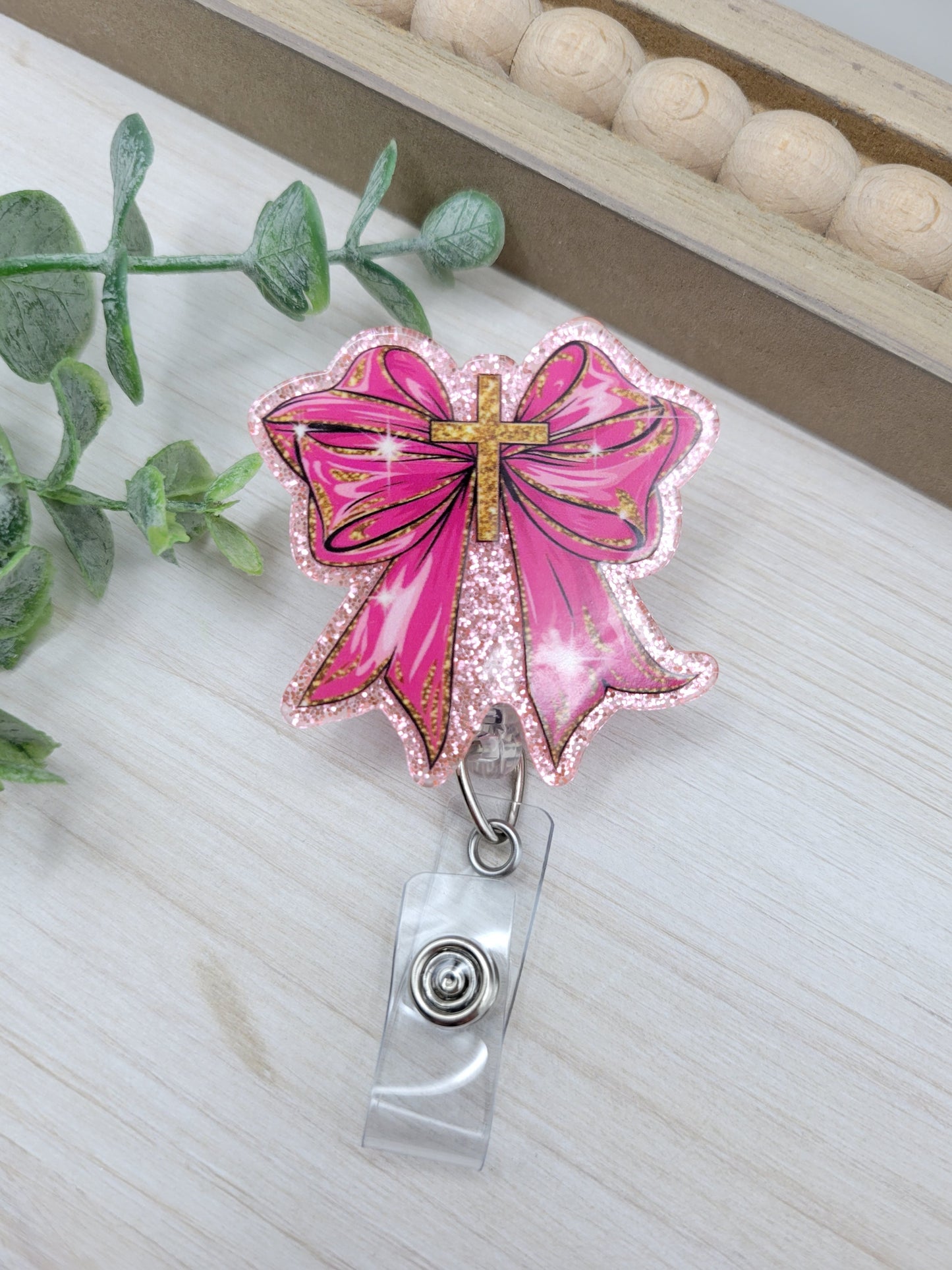 Pink Bow with Cross Badge Reel